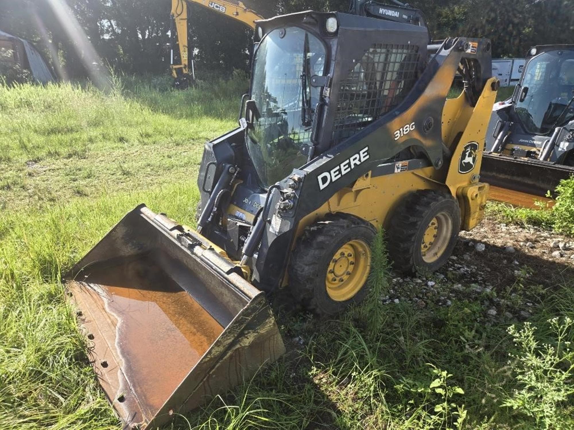 DEERE 318G ibe4RDD.jpeg